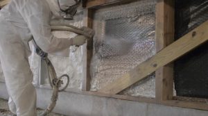 Man Installing agricultural spray foam insulation